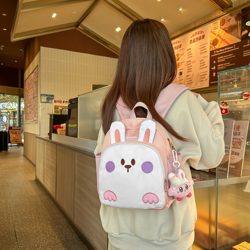 Cross-border kindergarten portable children's schoolbags for boys and girls, cute little rabbit backpacks for going out to play, anti-wandering schoolbags full figure