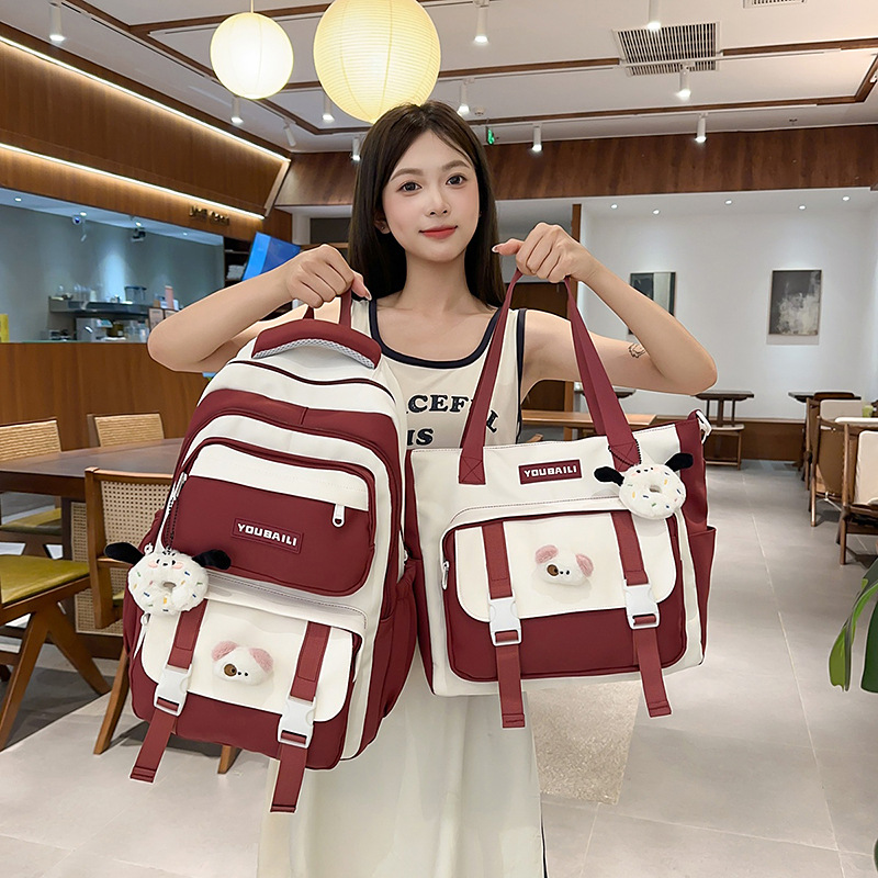 A new Korean-style backpack with a high aesthetic level, featuring a fresh and sweet college style, color-blocking and patchwork tutorial bag, and a backpack for junior and senior high school students full figure