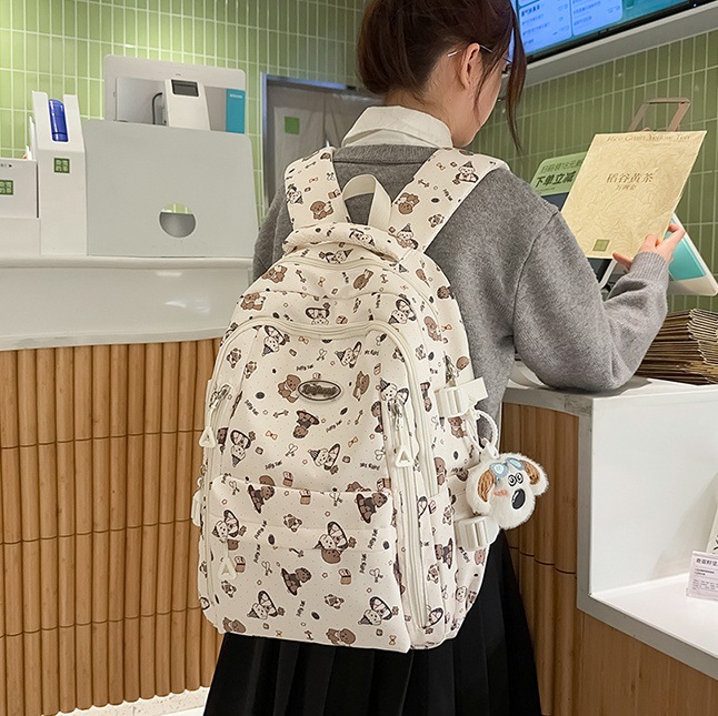 Korean cartoon printed schoolbag, a backpack for girls in junior and senior high school, fresh and cute, and a light backpack for primary school students full figure