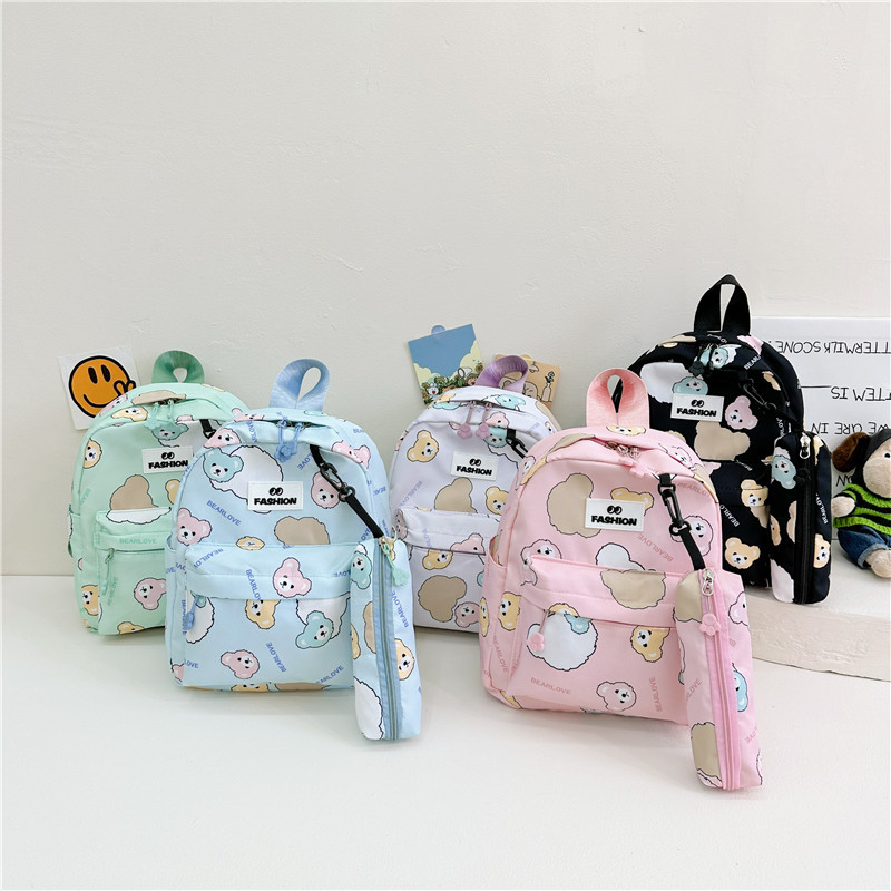 The 2024 new children's backpack cartoon kindergarten schoolbag with cute bear prints is a trendy lightweight backpack for boys and girls full figure