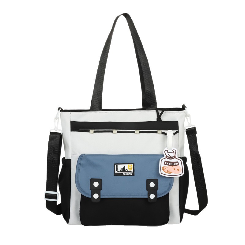 The 2025 new style of fresh, cute and color-blocking hand-held crossbody bag is simple and of high appearance level, a tote bag for primary and secondary school students' classes Item Picture