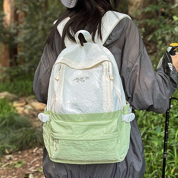 A new high-appearance-level forest-themed ins fresh and simple color-blocking backpack with a large capacity for women's lightweight travel details Picture