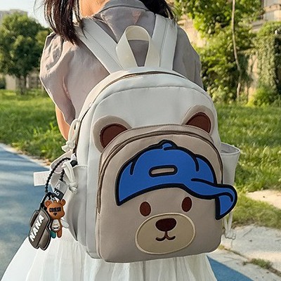 A new, cute cartoon bear backpack with a high level of appearance for kindergarten children in grades 3 to 5. It is a lightweight backpack details Picture