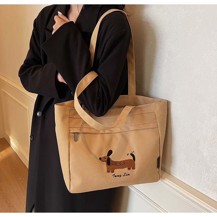 2025 New Korean-style artistic Dachshund embroidered hand and shoulder canvas casual, fashionable and versatile student tote bag full figure