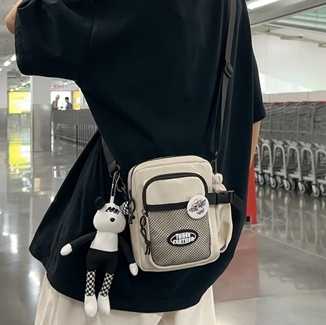 2024 New Japanese streetwear brand sports small bag, women's Harajuku style single-shoulder student phone bag, casual men's crossbody bag full figure