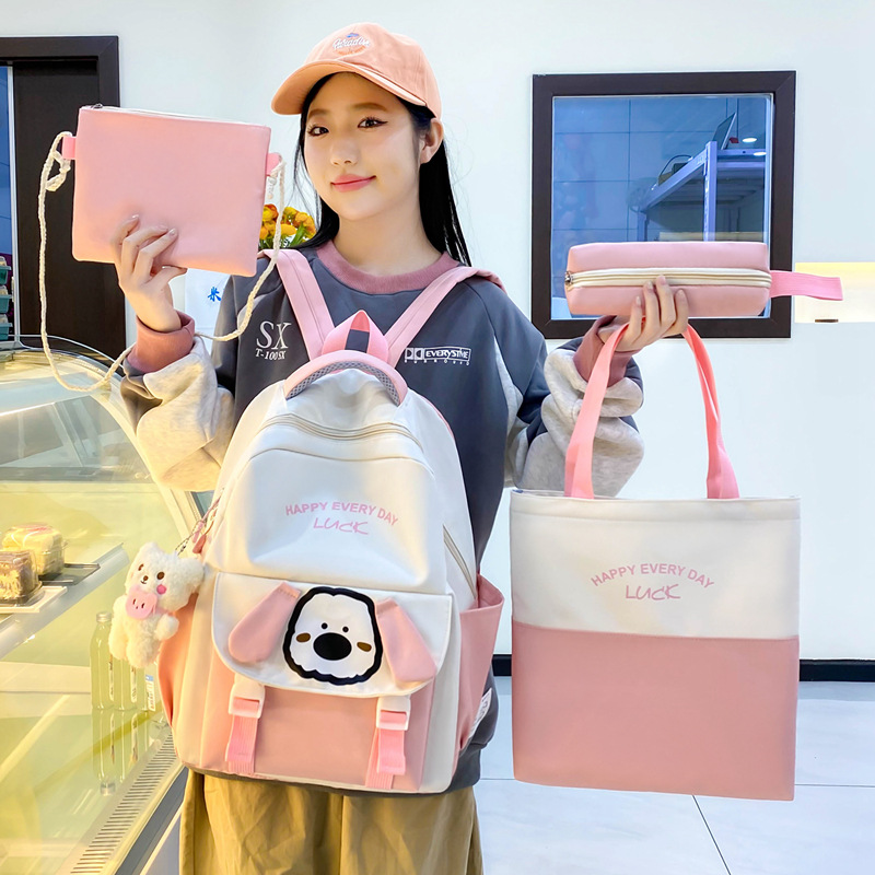 Cute and stress-relieving new schoolbag for primary school students, cartoon dog, casual junior high school student four-piece set, girls' backpack full figure