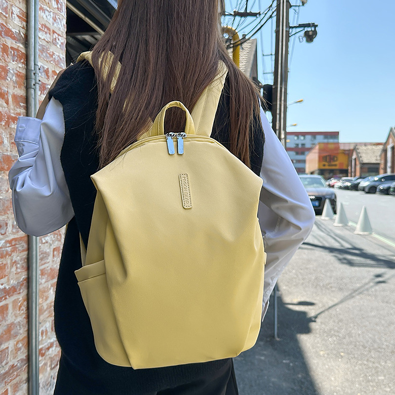 A fresh and sweet macaron-colored casual and simple large-capacity backpack, a new Japanese-style travel backpack for junior and senior high school students full figure