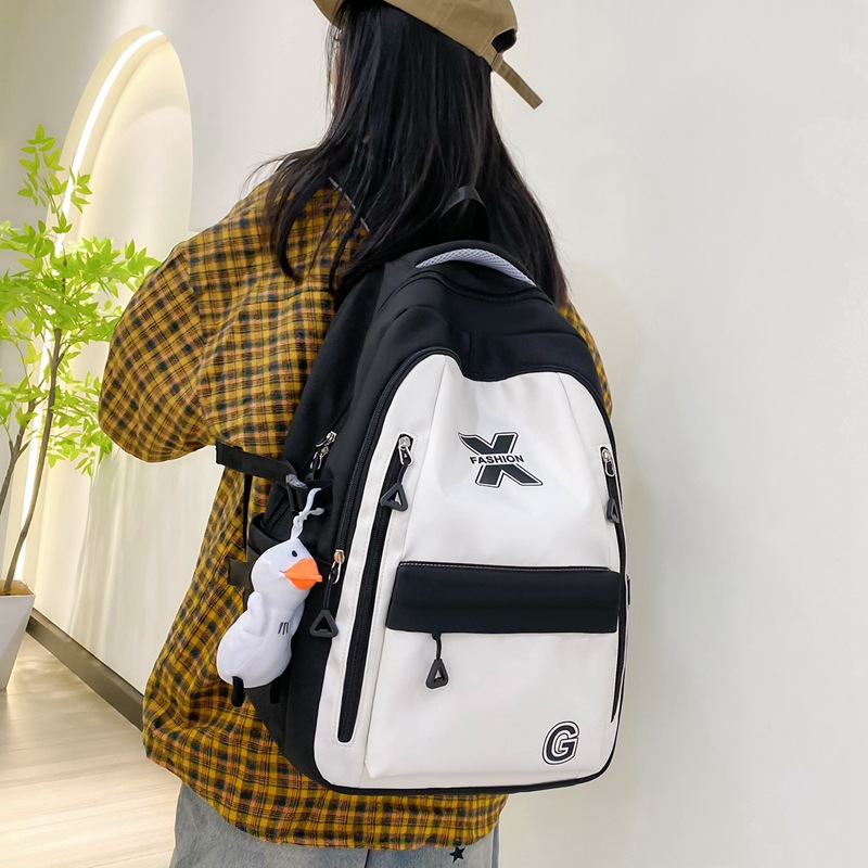 Wholesale of new large-capacity junior high school and senior high school schoolbags, female college student computer backpacks, simple and dirt-resistant casual backpacks Application Scenario