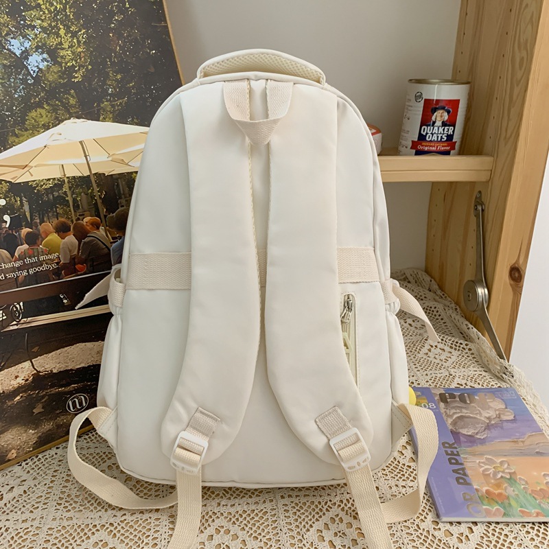 A large-capacity backpack for girls, a new 2024 model with multiple compartments, cream color, forest style, and a fresh and light campus student bag Specification drawing