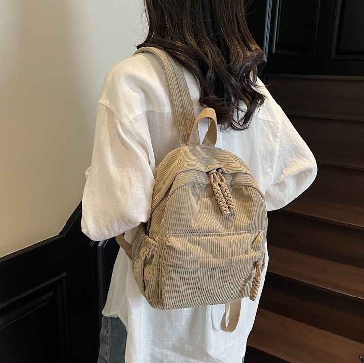 Korean version 2025 Summer new backpack for students, simple and casual, large-capacity commuting forest-style versatile schoolbag full figure