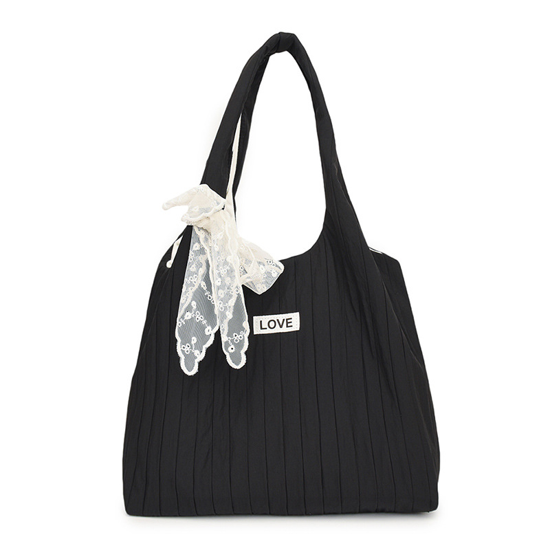 This large-capacity bag is a versatile choice for women in spring and summer. It's a new 2025 style single-shoulder fabric bag for young girls, featuring a laid-back and casual tote bag for classes Item Picture