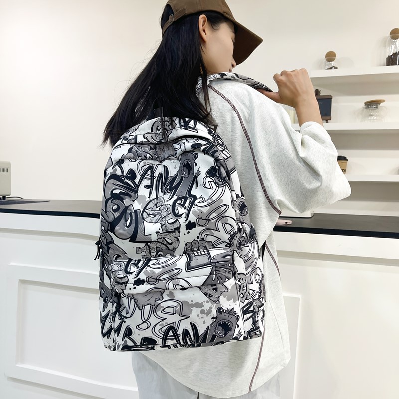 A new high-appearance-level personalized graffiti cool backpack from the Korean version of insi, a color-blocking backpack for junior and senior high school students details Picture