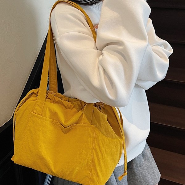 The new Korean-style ins high-quality, fresh candy-colored tote bag is simple, lightweight and a large-capacity crossbody bag for shopping full figure