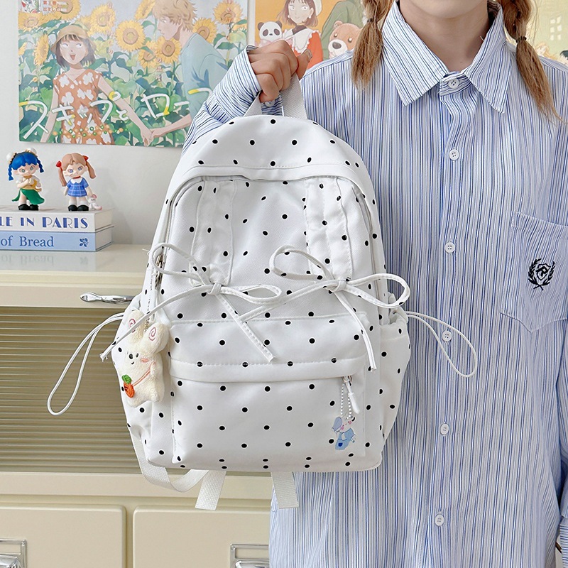 This is an Instagram-style, niche, and highly attractive polka dot Korean-style backpack for young girls. It is lightweight and a travel backpack for junior high school and college students full figure