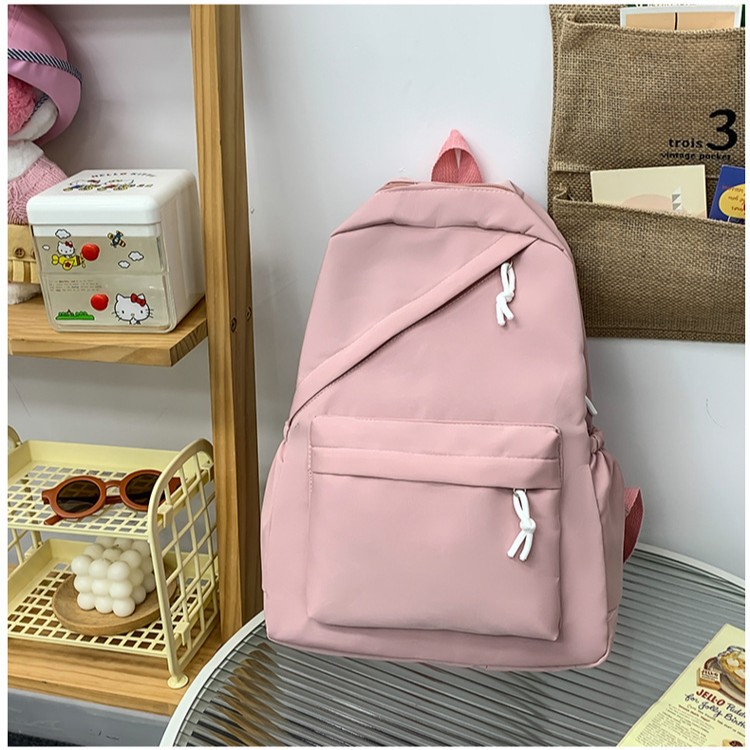 The new forest-themed solid color is simple and versatile. It is a large-capacity, lightweight backpack for junior high school, senior high school and college students details Picture