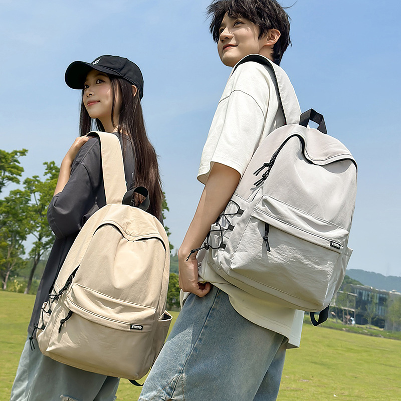 A new high-look, fresh and solid-color casual backpack from the Korean version of ins. It's a simple, lightweight and large-capacity backpack for couples details Picture