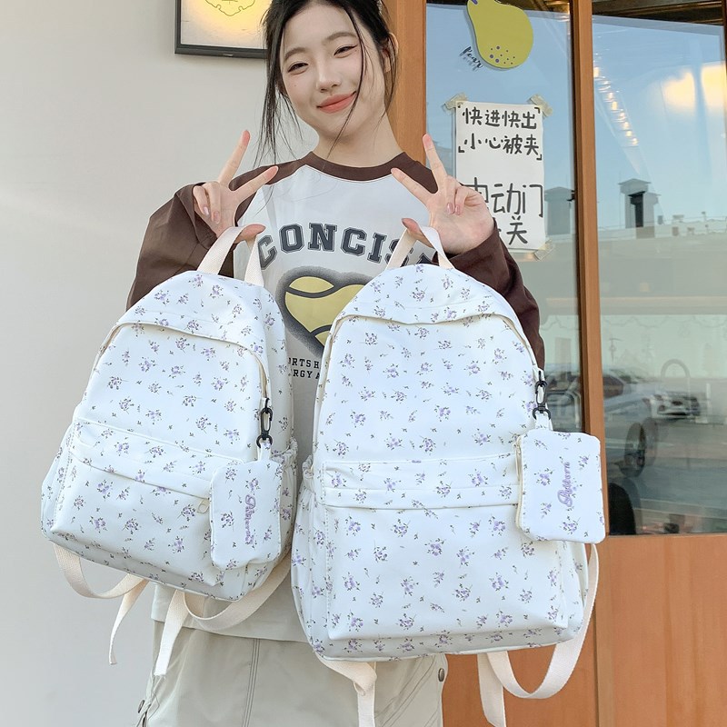 The new 2025 fresh and cute floral backpack is a simple, lightweight and versatile large-capacity backpack for high school and junior high school students, suitable for daily commuting full figure