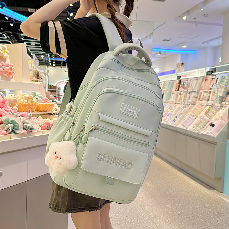 A new high-appeal Korean-style backpack with a fresh and sweet color contrast and splicing design. It is a large-capacity backpack for junior and senior high school students details Picture