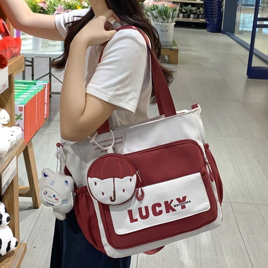 Primary school student tutorial bag, hand-held bag, shoulder bag, girls' versatile color-blocking tote bag, large-capacity file bag, book bag for class full figure