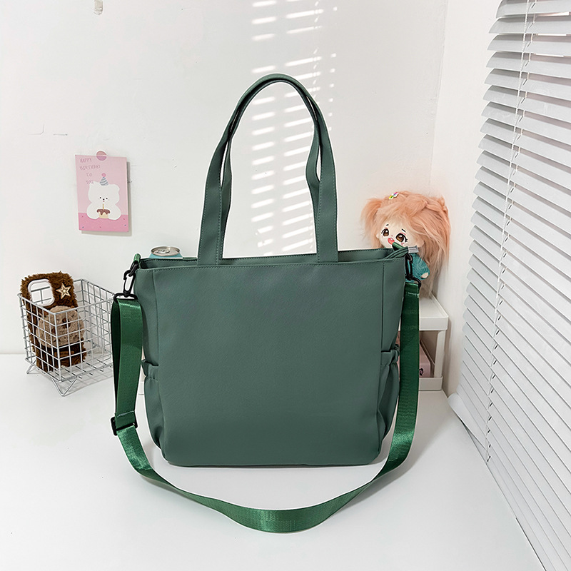 Large-capacity cartoon school-style single-shoulder bag for female primary school students to carry books for class tutoring. High appearance level student crossbody bag Specification drawing