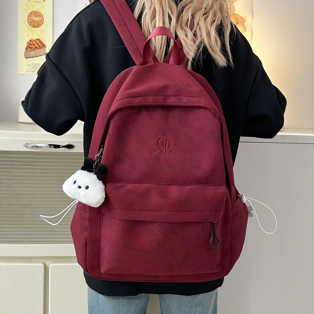 2025 New style of large-capacity, fashionable, solid-color, simple and versatile schoolbag for women on Instagram, a travel backpack for junior and senior high school students full figure