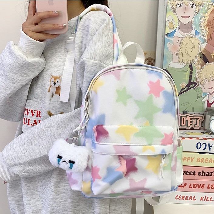 This is a simple and versatile backpack for primary and secondary school students with a high level of appearance, featuring fresh rainbow and star prints and contrasting colors details Picture