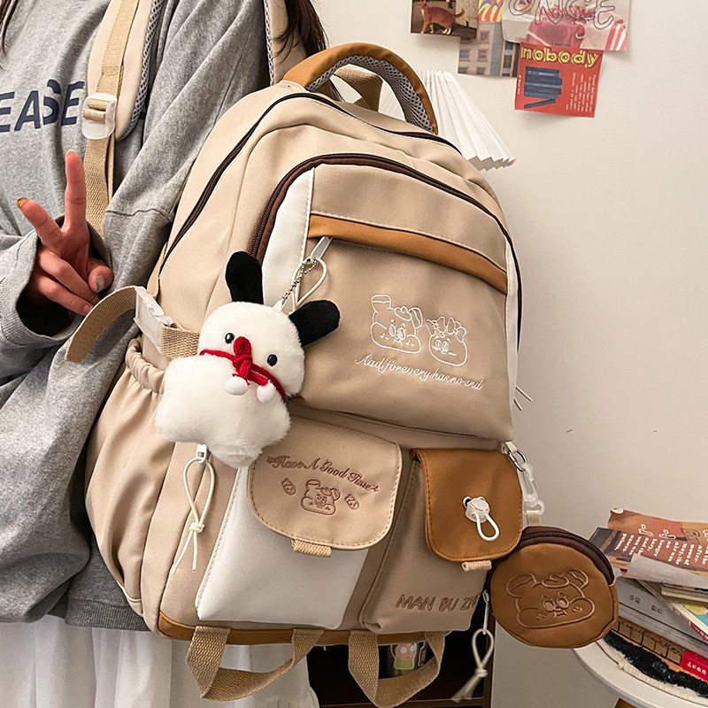New Japanese-style ins high-appearance-level primary school student embroidered backpacks and large-capacity color-blocking middle school student backpacks full figure