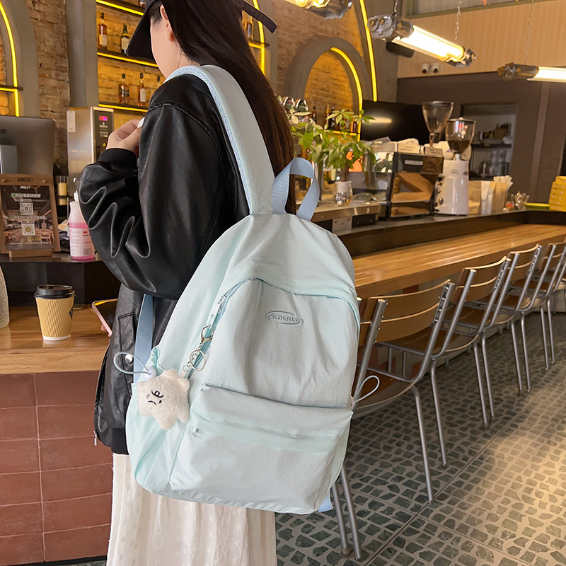 A fresh and simple solid-color schoolbag for female college students, a versatile backpack with high appearance standards, a simple and lightweight travel backpack for study Tours details Picture