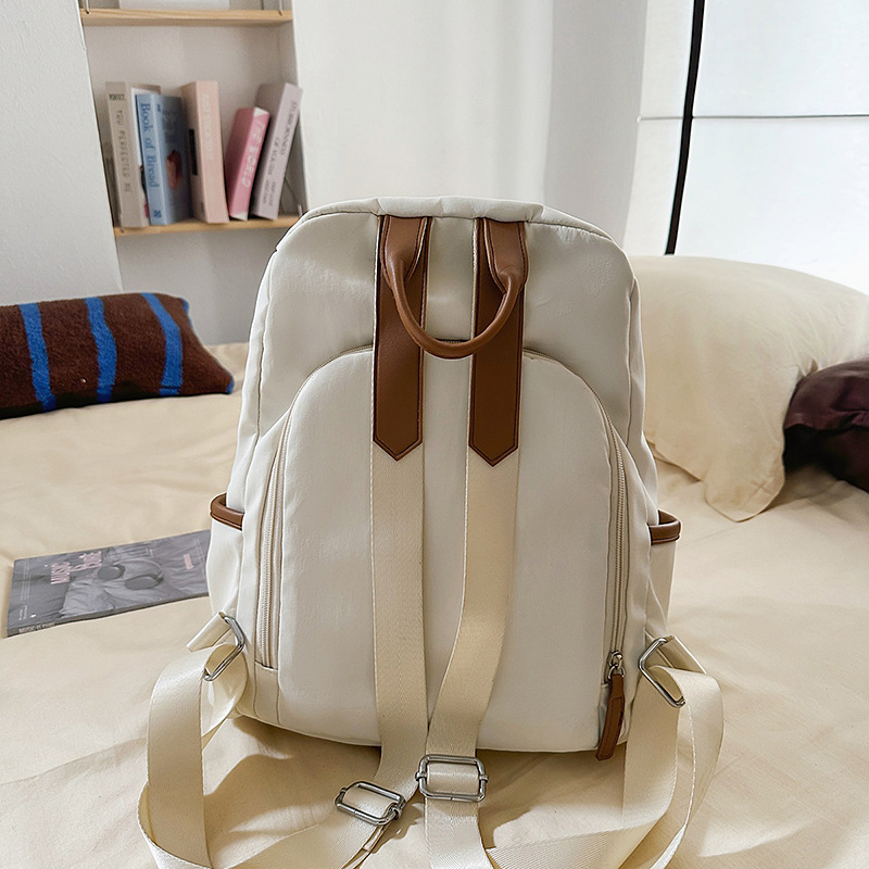 A new Japanese-style ins fresh and sweet candy-colored backpack, a simple and large-capacity backpack in solid colors for junior and senior high school students Specification drawing