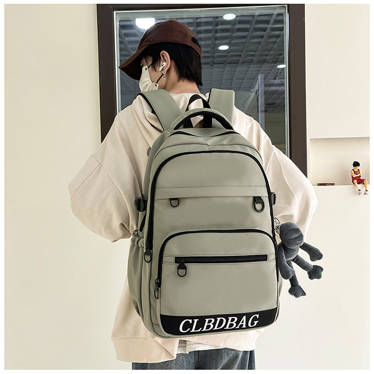 "Schoolbag Man 2024 New style simple and casual middle school backpack Solid color versatile letter trendy travel backpack. full figure