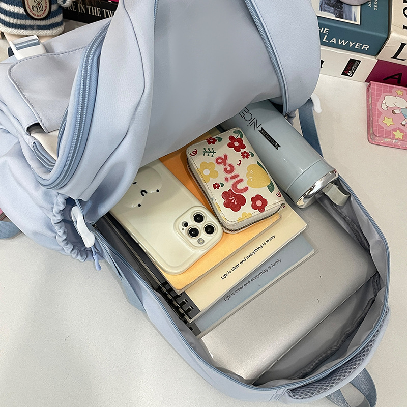 A new Japanese-style ins high-appearance-level fresh and sweet "smug pain bag" for girls, a lightweight and large-capacity backpack for junior and senior high school students Application Scenario
