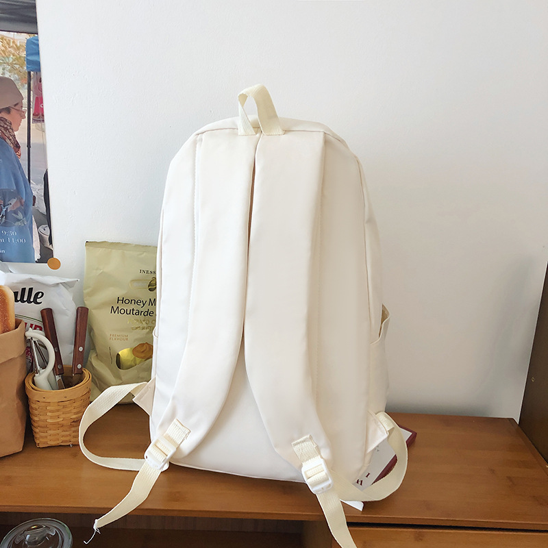 A new solid-color Korean-style casual backpack for junior high school students in an ins style Specification drawing