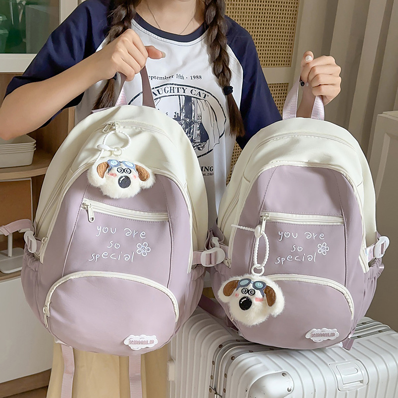 A new Korean-style Instagram backpack with a high level of appearance, fresh and sweet candy color, and a color-blocking double-shoulder bag for junior and senior high school students full figure