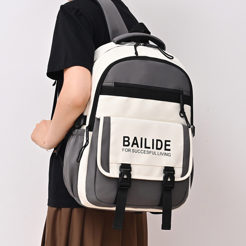 A new Korean-style ins high-appeartion-level workwear backpack with a school style and color-blocking splicing, and a large-capacity backpack for junior and senior high school students full figure