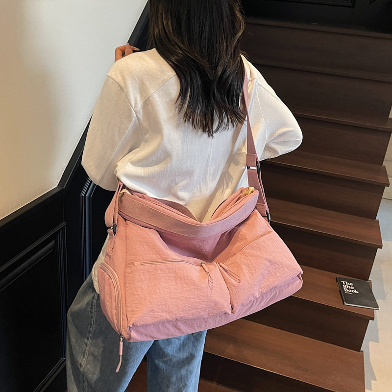 A new Korean-style ins tote bag with a high level of appearance, fresh and sweet, candy-colored, lightweight storage, and a crossbody bag for travel and shopping details Picture