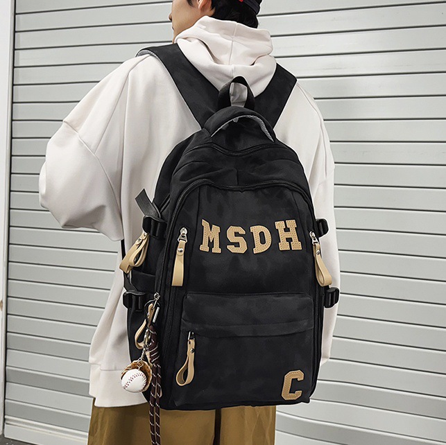 A large-capacity, trendy and casual college student couple backpack with a Korean college style and lettered travel backpack full figure