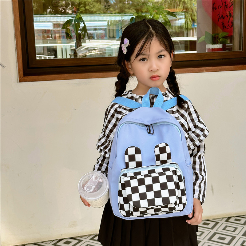 The 2023 new autumn student backpack with a checkerboard pattern and rabbit ears features a large capacity, high appearance level and versatile backpacks Specification drawing