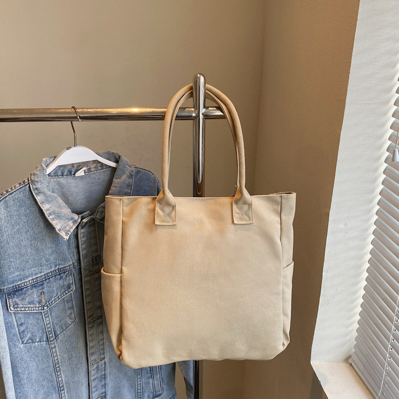 2025 New Japanese-Korean Forest style large-capacity student class tote bag, solid color simple single-shoulder bag, versatile handbag Application Scenario