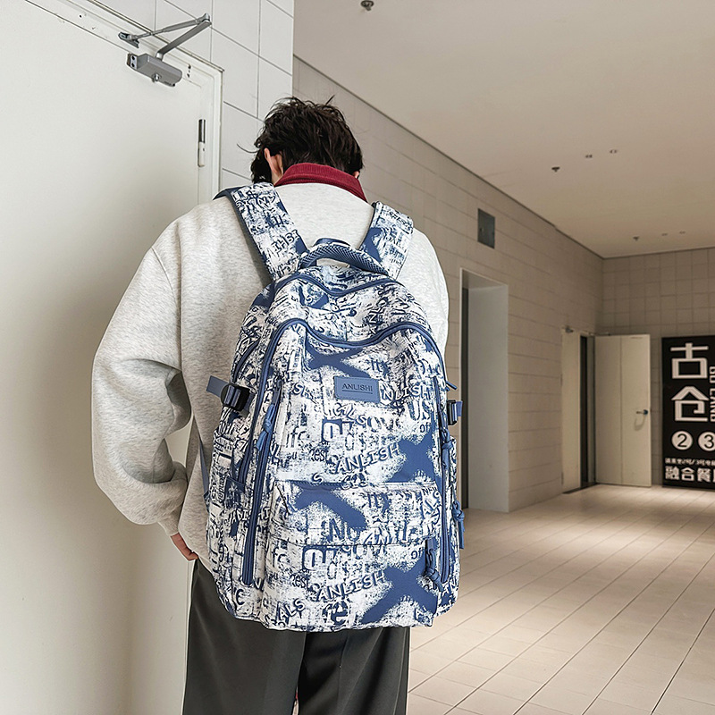 A new type of schoolbag for boys, featuring a unique, trendy and cool graffiti style. It is a large-capacity, lightweight backpack for primary and secondary school students in grades 3 to 6 full figure