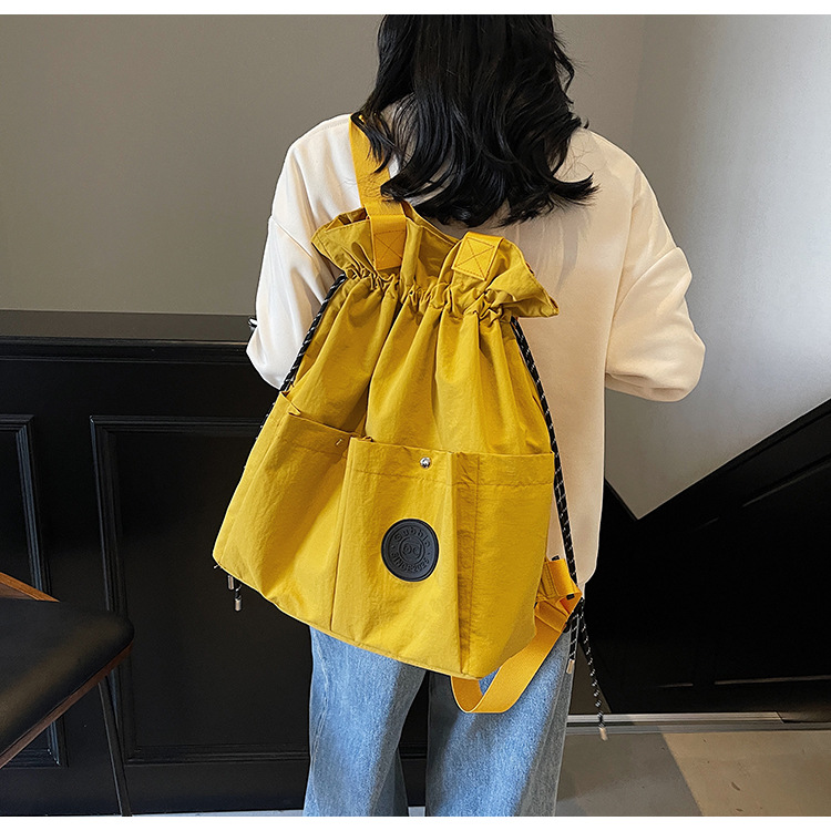 New 2025 lightweight backpack for women, drawstring pocket travel bag, college student schoolbag, casual and trendy backpack full figure