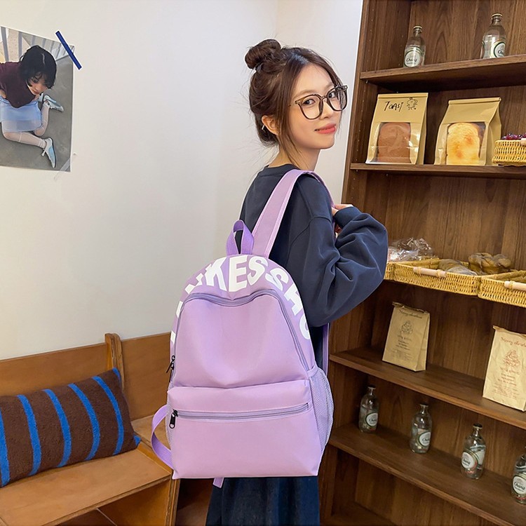 Japanese-style solid-color letter versatile schoolbag, simple and lightweight backpack, large-capacity casual travel backpack for class commuting details Picture