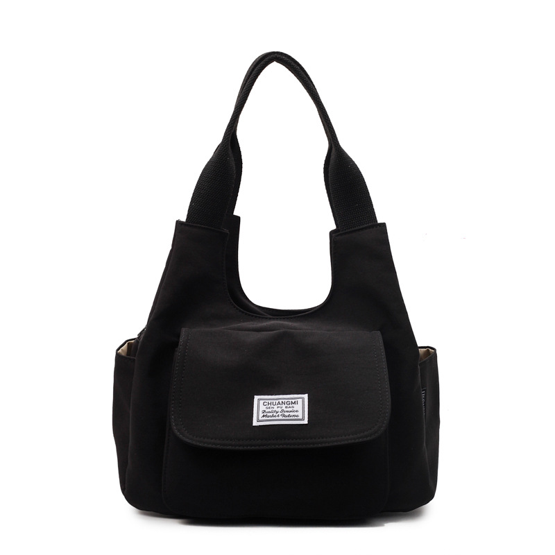 A Japanese-style InS-style retro single-shoulder bag for commuting, a niche design sense canvas bag, and a simple solid color casual commuting crossbody bag Item Picture