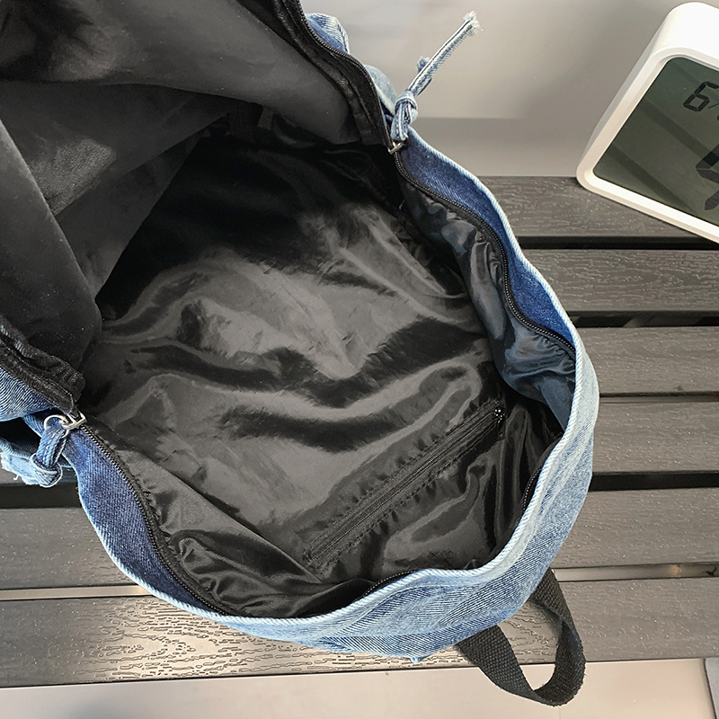 2025 New casual college style single-shoulder bag for couples, fashionable college student schoolbag, simple and lightweight denim backpack Application Scenario