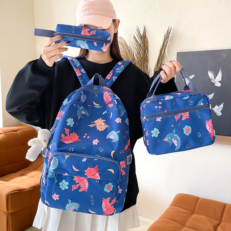 A cute cartoon printed backpack with high appearance level, a fresh and clean schoolbag, and a three-piece set of insulated bento backpacks for girls in junior and senior high school details Picture