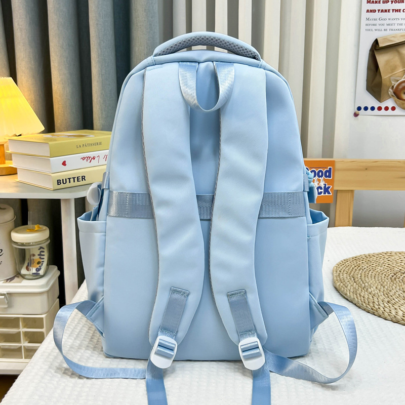 A new high-appeal, fresh and sweet school-style color-blocking backpack for junior and senior high school students, a lightweight travel backpack Specification drawing