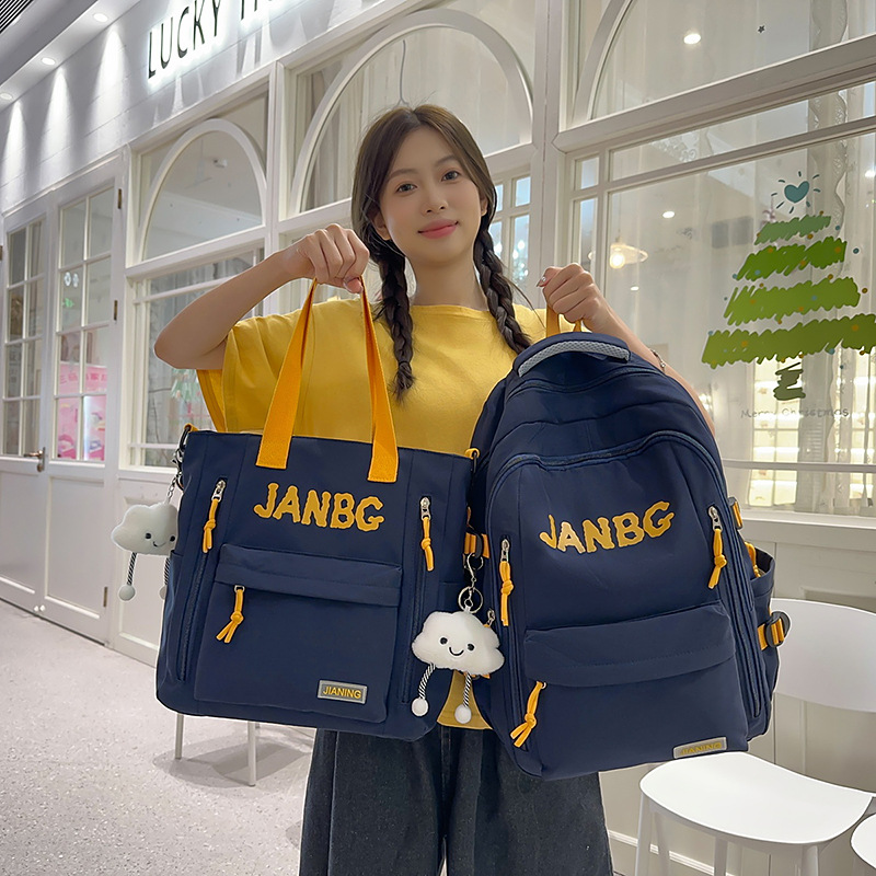A new high-appeal Korean-style ins letter backpack for couples, featuring a casual, simple and lightweight design with a large capacity for going out full figure