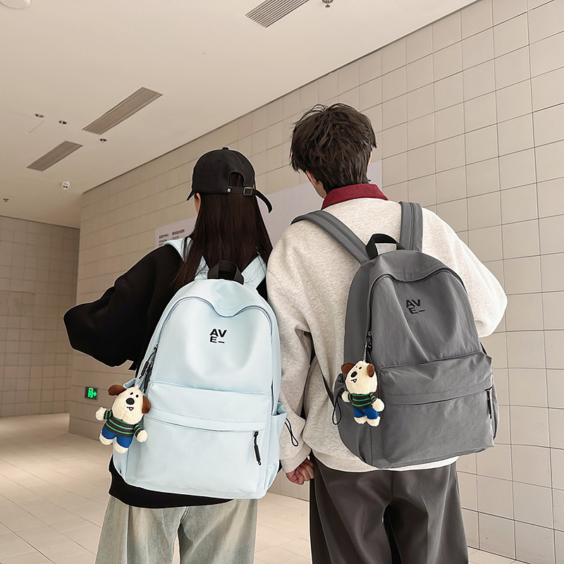 Korean version couple simple large-capacity backpack, casual commuting college student schoolbag, niche lightweight travel backpack full figure