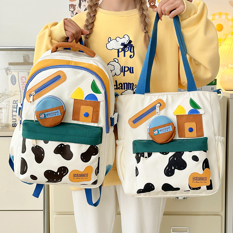 Japanese-style InS-style soft and cute girl backpack, trendy graffiti casual primary school student lightweight two-piece schoolbag full figure