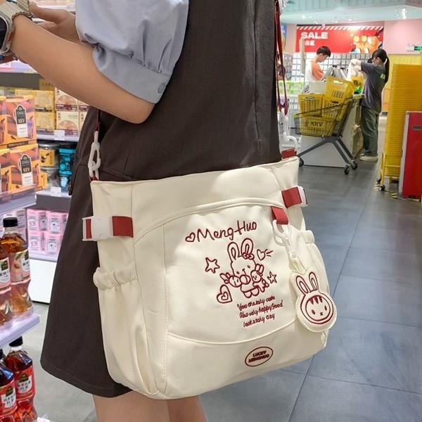 2025 New Japanese-style sweet girl shopping tote bag with large capacity and letter embroidery, a middle school student class tutorial bag full figure