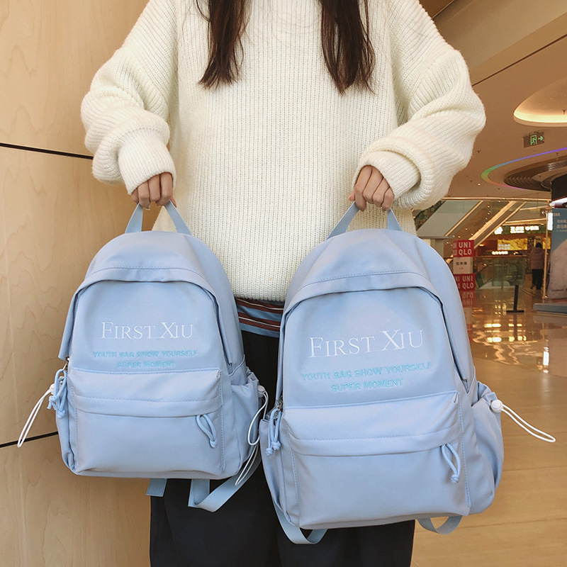 Korean InS-style versatile schoolbag for middle and high school students, solid color letter backpack, high appearance level, simple and lightweight backpack full figure